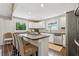 Eat-in kitchen featuring a center island and stainless appliances and natural lighting at 400 N Peachtree Pkwy, Peachtree City, GA 30269