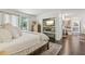Airy bedroom with a fireplace and bookshelves leading to the en-suite bathroom and deck at 400 N Peachtree Pkwy, Peachtree City, GA 30269