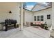 Inviting outdoor patio featuring a grill, comfortable seating, and stylish decor for relaxing and entertaining at 400 N Peachtree Pkwy, Peachtree City, GA 30269