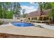 Backyard pool with diving board, deck, and lounge chairs offers relaxation and fun at 400 N Peachtree Pkwy, Peachtree City, GA 30269