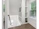 Bright stairway features display shelving, window and luxury vinyl plank flooring at 400 N Peachtree Pkwy, Peachtree City, GA 30269