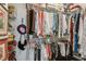 Spacious walk-in closet with ample storage, including hanging racks, shelves, and drawers at 400 N Peachtree Pkwy, Peachtree City, GA 30269