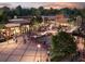 A vibrant street view captures the energy of the community with shops, pedestrians, and outdoor dining areas at 4109 Abbotts Bridge Rd, Duluth, GA 30097