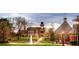 A picturesque town square features a beautiful fountain, historic buildings, and meticulously maintained green spaces at 4109 Abbotts Bridge Rd, Duluth, GA 30097