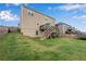 Spacious backyard featuring a well-maintained lawn and a wooden deck, perfect for outdoor entertaining at 704 Woodbridge Dr, Woodstock, GA 30188