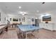 Spacious basement with a ping pong table, and a bar with a stainless steel refrigerator at 704 Woodbridge Dr, Woodstock, GA 30188