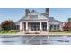 Elegant clubhouse with symmetrical design, brick accents, and ample parking at 704 Woodbridge Dr, Woodstock, GA 30188