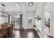 Bright dining room showcasing wood floors, modern light fixture, and large windows at 704 Woodbridge Dr, Woodstock, GA 30188