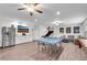 Spacious game room features stainless steel refrigerator, ping pong table, and comfortable seating at 704 Woodbridge Dr, Woodstock, GA 30188