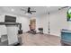 Exercise room features a fan, treadmill, weight bench, and mounted flat screen TV at 704 Woodbridge Dr, Woodstock, GA 30188