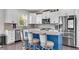Modern kitchen with stainless steel appliances, granite counters, and a center island with seating at 704 Woodbridge Dr, Woodstock, GA 30188