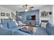 Inviting living room with a fireplace and sectional sofa offers a cozy atmosphere at 704 Woodbridge Dr, Woodstock, GA 30188