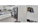 Mudroom featuring built-in bench with hooks and shoe storage near the kitchen at 704 Woodbridge Dr, Woodstock, GA 30188