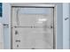 Clean shower with glass door, shower head, safety bars, and built-in shelves at 704 Woodbridge Dr, Woodstock, GA 30188