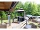 Backyard deck featuring outdoor kitchen, seating and covered area at 814 Clarke Trl, Dacula, GA 30019