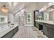 Spacious bathroom with double vanities, large tub, and a glass-enclosed shower at 814 Clarke Trl, Dacula, GA 30019