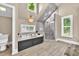 Elegant bathroom showcasing a soaking tub, shower, and window with natural light at 814 Clarke Trl, Dacula, GA 30019