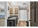 Updated bathroom featuring a black vanity and a shower with a white curtain, and bright vanity lighting at 814 Clarke Trl, Dacula, GA 30019