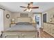 Comfortable bedroom with a ceiling fan, neutral tones, and bedside tables at 814 Clarke Trl, Dacula, GA 30019