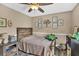 Comfortable bedroom with a wood-framed bed, playful wall decor, and a cozy atmosphere perfect for relaxation and rest at 814 Clarke Trl, Dacula, GA 30019