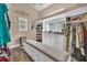 Walk-in closet with built-in shelving and plenty of storage for clothes and accessories at 814 Clarke Trl, Dacula, GA 30019