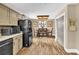 Open concept dining area featuring modern wood look flooring and lots of natural light at 814 Clarke Trl, Dacula, GA 30019