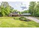 Charming single-Gathering home with large manicured front lawn and a covered parking area at 814 Clarke Trl, Dacula, GA 30019