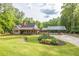 Charming single-Gathering home with large manicured front lawn and a covered parking area at 814 Clarke Trl, Dacula, GA 30019