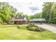 Charming single-Gathering home with large manicured front lawn and a covered parking area at 814 Clarke Trl, Dacula, GA 30019