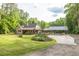 Charming single-Gathering home with large manicured front lawn and a covered parking area at 814 Clarke Trl, Dacula, GA 30019