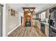 Rustic kitchen featuring brick accents, stainless appliances, and ample cabinet space at 814 Clarke Trl, Dacula, GA 30019