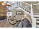 Cozy living room with wood-burning fireplace, a second story, and staircase at 814 Clarke Trl, Dacula, GA 30019