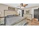 Relaxing bedroom with a ceiling fan, ensuite bathroom, and natural light at 814 Clarke Trl, Dacula, GA 30019