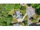 Aerial view of the house showcasing its roof, driveway, landscaping, and surrounding greenery at 1029 Laurel Grove Cts, Suwanee, GA 30024