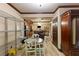 Open-concept basement area with a dining table, kitchenette, and ample shelving at 1029 Laurel Grove Cts, Suwanee, GA 30024