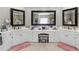 Spacious bathroom with dual vanity, mirrors, and white cabinets at 1029 Laurel Grove Cts, Suwanee, GA 30024