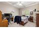 Bedroom features a bed and desk at 1029 Laurel Grove Cts, Suwanee, GA 30024