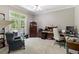 Spacious bedroom area with natural light, neutral walls, and access to an outdoor balcony at 1029 Laurel Grove Cts, Suwanee, GA 30024