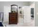 Bright bedroom featuring dresser with mirror, and doorways to bathroom and another bedroom at 1029 Laurel Grove Cts, Suwanee, GA 30024