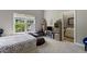 Bedroom with natural light from a window, a comfortable bed, and access to an ensuite bathroom at 1029 Laurel Grove Cts, Suwanee, GA 30024