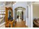 Welcoming foyer showcases an archway and hardwood floors adding to the home's charm at 1029 Laurel Grove Cts, Suwanee, GA 30024