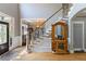 Inviting foyer with hardwood floors, stairs and a decorative mirror adding to the home's character at 1029 Laurel Grove Cts, Suwanee, GA 30024