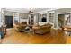 Cozy living room includes a fireplace, built-in shelving, and hardwood floors at 1029 Laurel Grove Cts, Suwanee, GA 30024