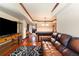 Spacious living room with a TV, comfortable seating, and a stylish pool table nearby at 1029 Laurel Grove Cts, Suwanee, GA 30024