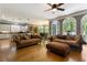 Open-concept living room features hardwood floors and large windows offering stunning outdoor views at 1029 Laurel Grove Cts, Suwanee, GA 30024