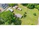 Aerial view of a home with spacious backyard, outbuildings, and perimeter outlined in red at 110 Barnesdale Ter, Woodstock, GA 30188