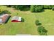 Expansive backyard featuring a classic red barn-style outbuilding on a well-maintained lawn at 110 Barnesdale Ter, Woodstock, GA 30188