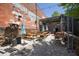 Inviting outdoor seating area with patio heaters, picnic tables and exposed brick, perfect for dining and socializing at 110 Barnesdale Ter, Woodstock, GA 30188