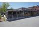 Lively restaurant with ample outdoor seating, a modern facade, and a bustling atmosphere at 110 Barnesdale Ter, Woodstock, GA 30188