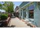 Charming storefront with a quaint, inviting entrance, decorative floral arrangements, and sidewalk seating at 110 Barnesdale Ter, Woodstock, GA 30188